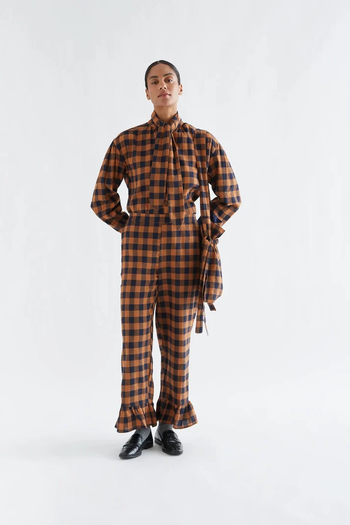 100% cotton pants with a brown and navy plaid pattern