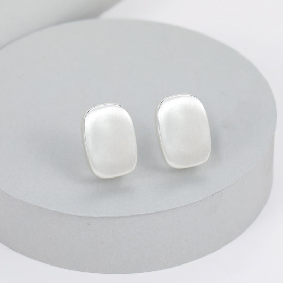 Lucy Clip On Earrings in Matt Silver