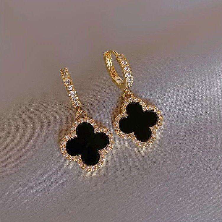 Black Clover Huggie Earrings In Gold