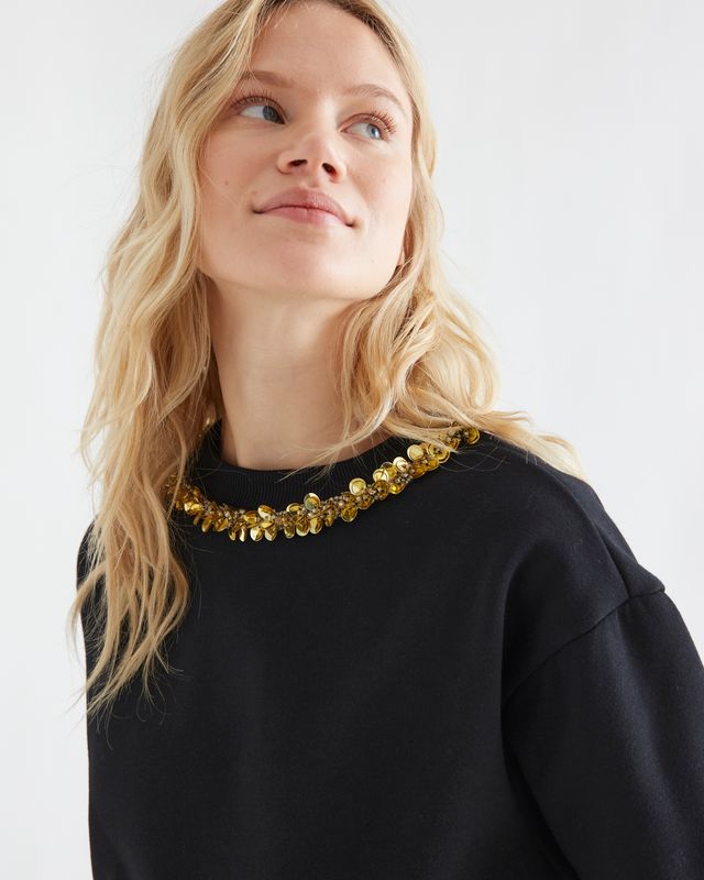 Black sweatshirt with golden jewel neck