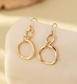 Jenna Dangly Earrings in Gold